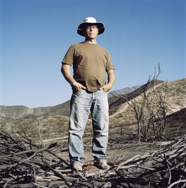 John Glance,
Musician,
Standing on land right behind his house that got burned by the "station fire" in September 2009,
Acton, California, USA