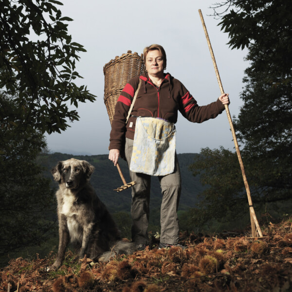 Giulia Scola with her dog Scheggia,
Chestnut gatherer,
Vezio, Alto Malcantone, Ticino