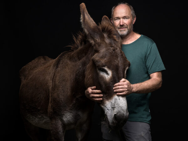 Bruno Lötscher with his donkey Lola, 
Veterinarian.  
Lost his house in floods due to torrential rains.
Brienz, BE, Switzerland