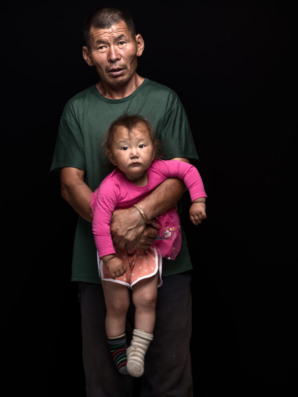 Sukhbaatar Gombosuren with his daughter Myagmar, 
Unemployed, former herder, 
Baruun-Urt, Sukhbaatar, Mongolia